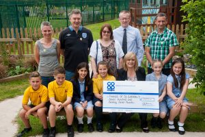 Pictured at cheque presentation in prayer garden are Sam Herne, Daniel Perks, Francesca Pursglove, Aoife Hitchings, Julie Gasper, Tamworth Co-op business support manager, Maddie Booth and Evie McGowan, with Friends of St Gabriel’s members Louise Vernon, Steve Pursglove (treasurer) Mairead Hitchings, John Hayes, head teacher of St Gabriel’s Primary School, and Rob Vernon (chairperson).