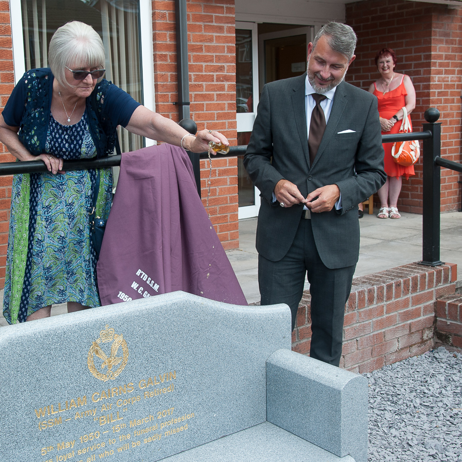 Memorial bench to Tamworth funeral director doused with his favourite tipple at unveiling