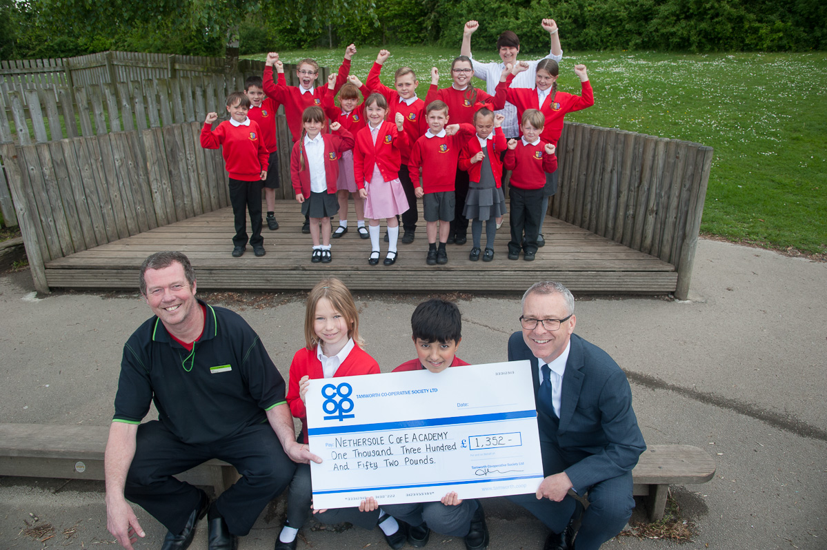 Polesworth Co-op store manager hands huge cheque to old school